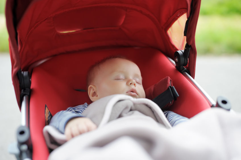 33678514 - sweet little baby boy sleeping in stroller